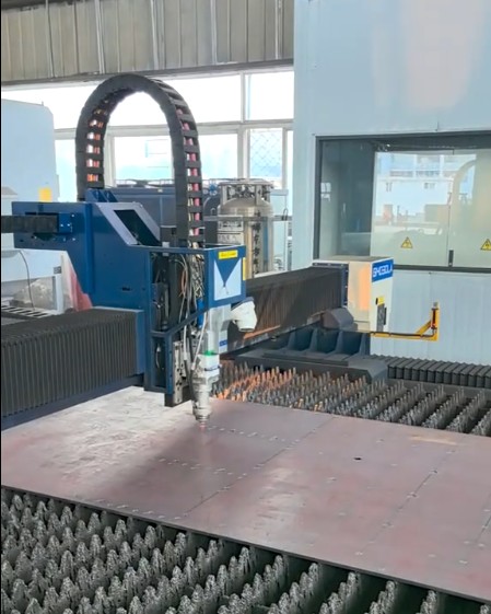 Cutting head positioned above sheet material